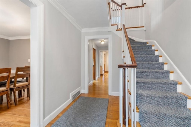 103 Randlett Park, Newton, MA 02465 - stairway featuring ornamental molding and wood finished floors
