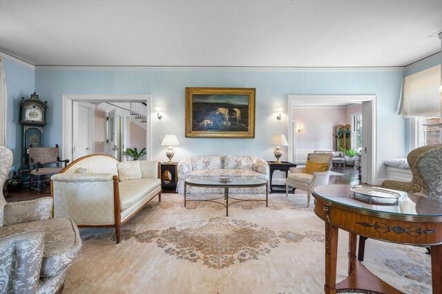 living room featuring crown molding and hardwood / wood-style flooring