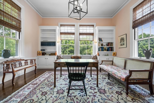 office featuring plenty of natural light, ornamental molding, and hardwood / wood-style floors