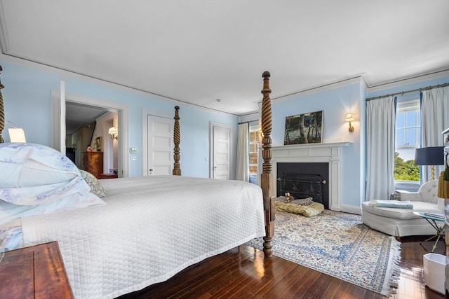 bedroom with ornamental molding and hardwood / wood-style flooring