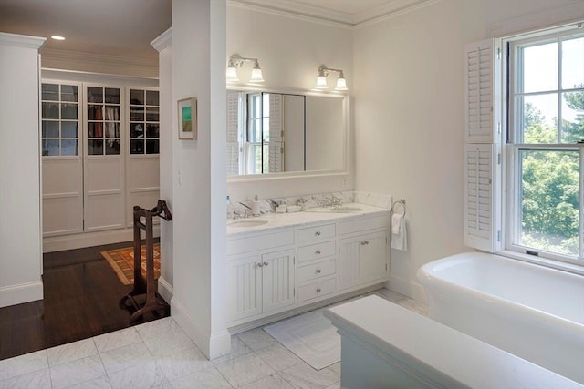 bathroom with dual sinks, tile flooring, crown molding, and large vanity