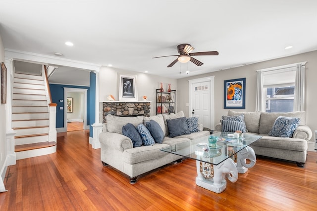 living room with hardwood / wood-style floors and ceiling fan