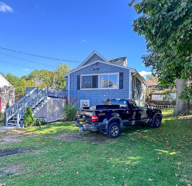 exterior space with a yard and a deck