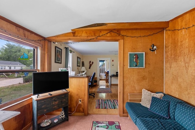 64 Bayside Dr, Falmouth, MA 02540 - living area featuring a desk, light tile patterned floors, and wood walls