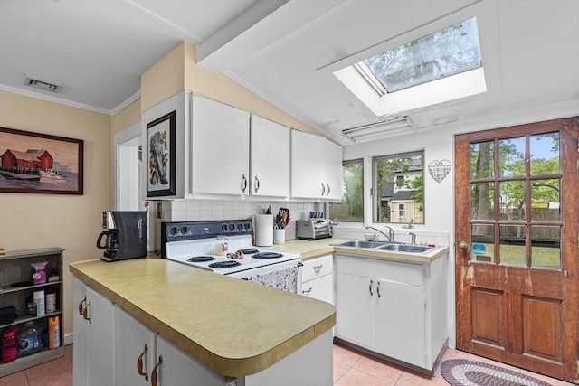 64 Bayside Dr, Falmouth, MA 02540 - kitchen featuring white range with electric cooktop, a sink, a skylight, and light tile patterned floors