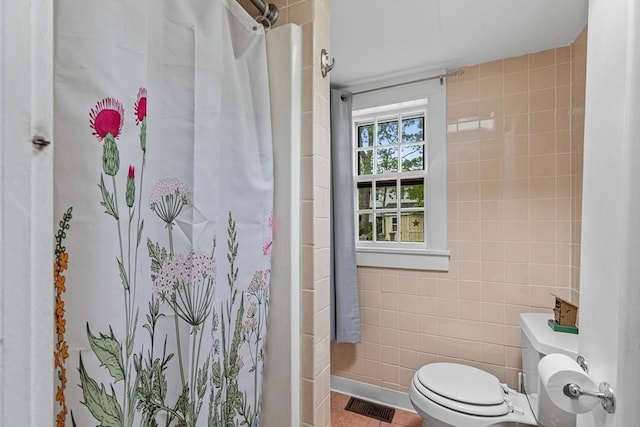 64 Bayside Dr, Falmouth, MA 02540 - bathroom with tile walls, toilet, and a shower with shower curtain