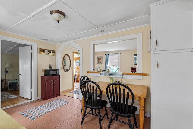 64 Bayside Dr, Falmouth, MA 02540 - dining room featuring light tile patterned floors, crown molding, and baseboards