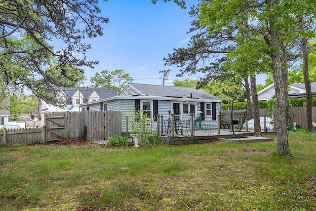 64 Bayside Dr, Falmouth, MA 02540 - back of house with a gate, a wooden deck, and roof with shingles