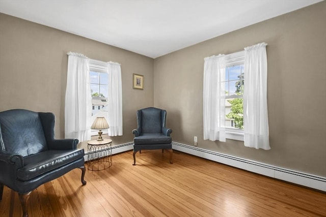 9 Aspinwall Ave, Weymouth, MA 02191 - sitting room with a baseboard radiator and wood finished floors