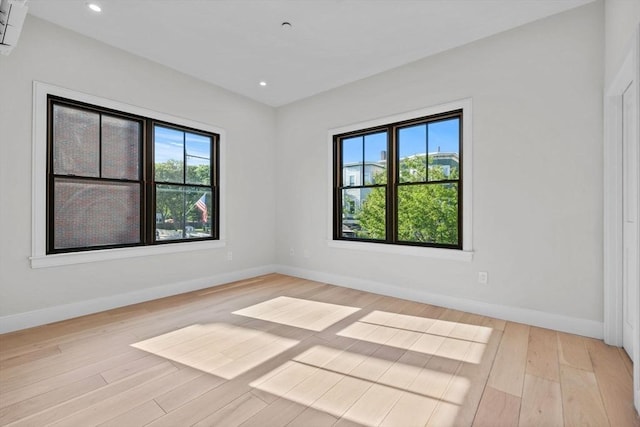 1 Marion St Unit 2, Cambridge, MA 02141 - empty room featuring plenty of natural light, wood finished floors, baseboards, and recessed lighting