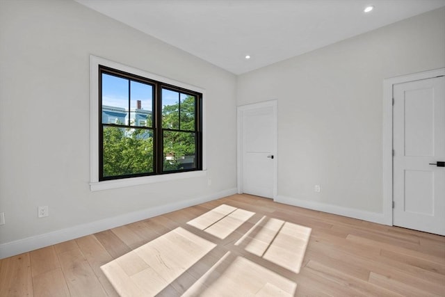 1 Marion St Unit 2, Cambridge, MA 02141 - empty room with light wood finished floors, baseboards, and recessed lighting