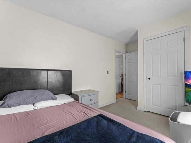 135 Border St Unit 135, Northbridge, MA 01588 - bedroom with light colored carpet and baseboards