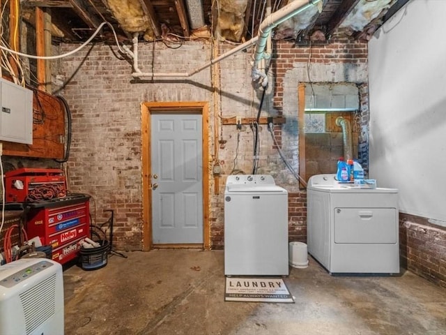135 Border St Unit 135, Northbridge, MA 01588 - laundry room with separate washer and dryer, brick wall, and electric panel