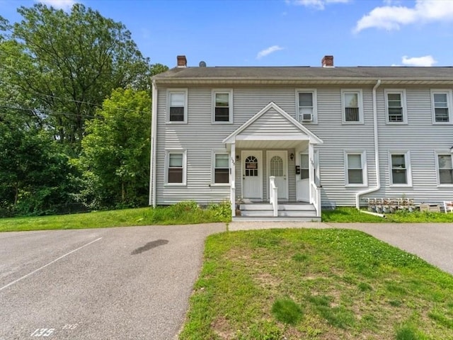 135 Border St Unit 135, Northbridge, MA 01588 - townhome / multi-family property with a chimney, a front yard, and uncovered parking