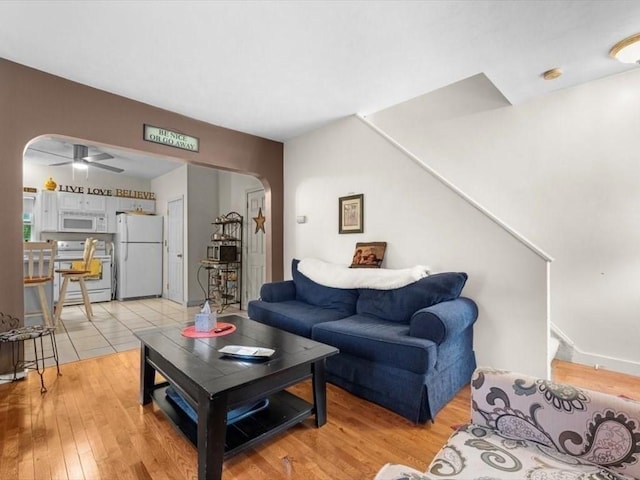 135 Border St Unit 135, Northbridge, MA 01588 - living area with arched walkways, ceiling fan, and light wood-type flooring