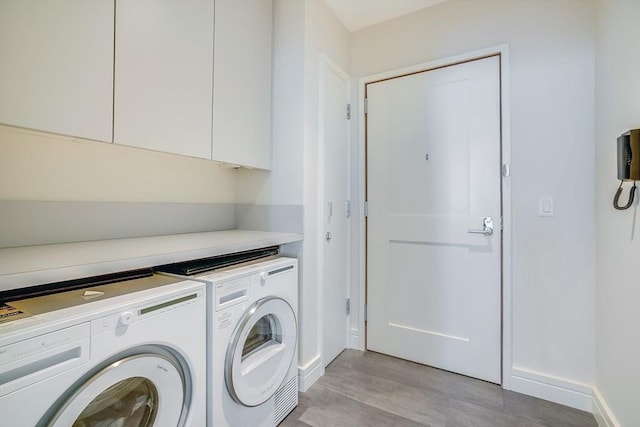 1 Dalton St Unit 4504, Boston, MA 02115 - laundry area with independent washer and dryer, cabinet space, and light wood-style flooring