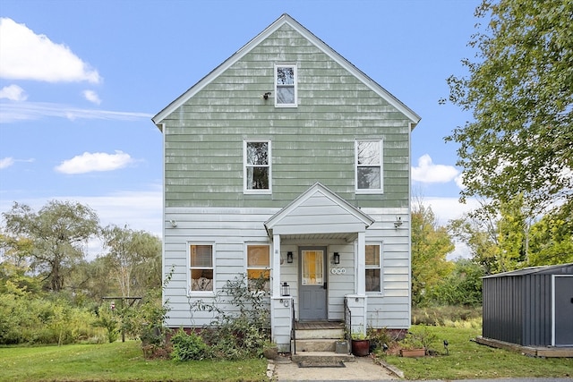 view of front of property with a front lawn