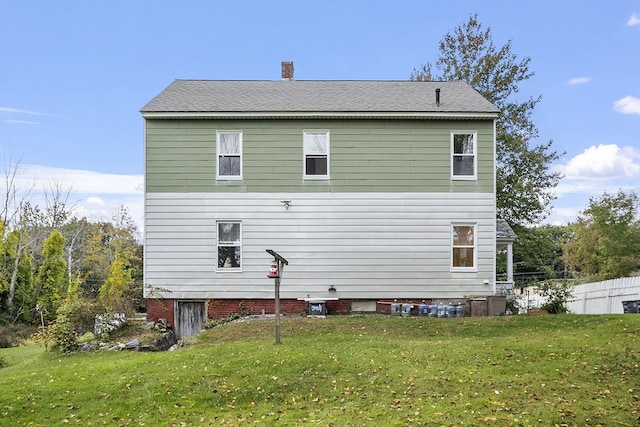 back of house with a yard