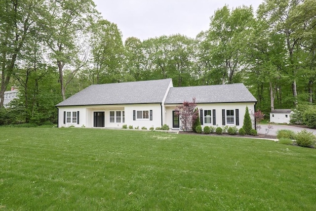 39 Chestnut St, Hopkinton, MA 01748 - view of front of house featuring a front yard and view of scattered trees
