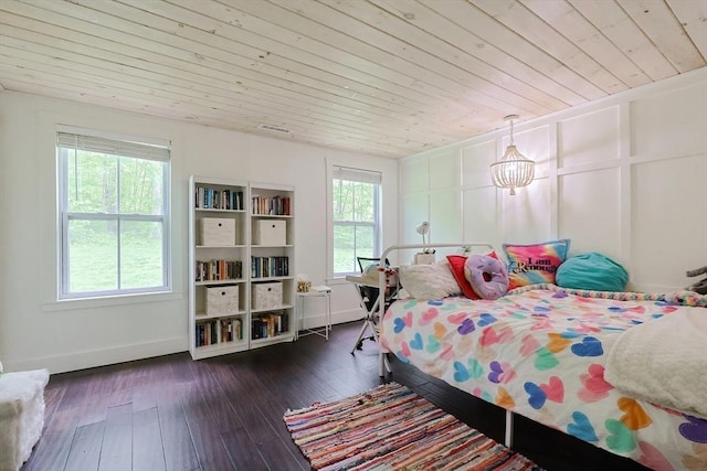 39 Chestnut St, Hopkinton, MA 01748 - bedroom with multiple windows, wooden ceiling, dark wood-type flooring, and baseboards