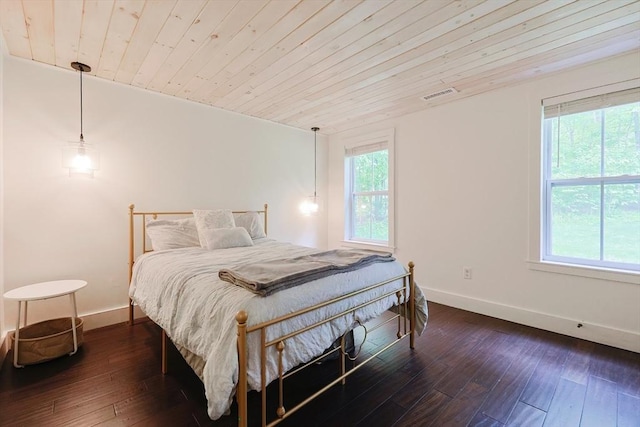 39 Chestnut St, Hopkinton, MA 01748 - bedroom with multiple windows, wooden ceiling, dark wood finished floors, and baseboards