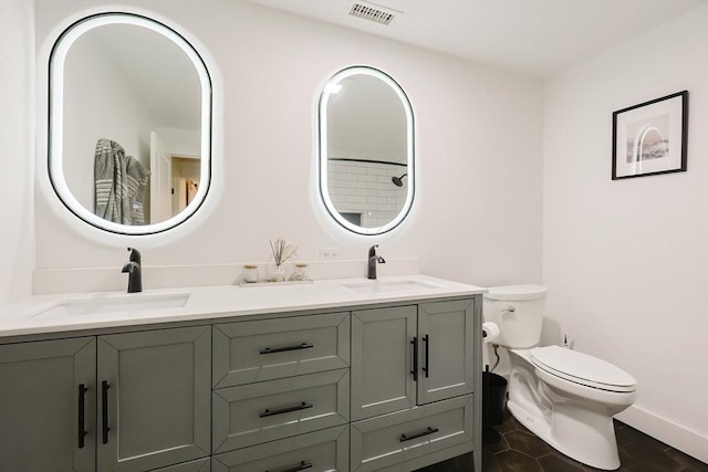 39 Chestnut St, Hopkinton, MA 01748 - full bathroom featuring toilet, double vanity, baseboards, and tile patterned floors