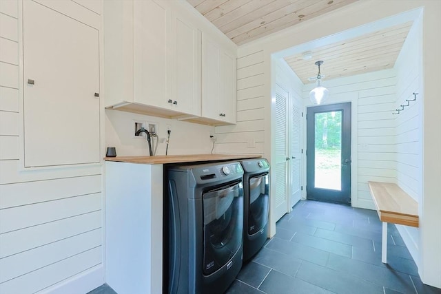 39 Chestnut St, Hopkinton, MA 01748 - laundry room featuring wooden ceiling, separate washer and dryer, wood walls, cabinet space, and dark tile patterned floors
