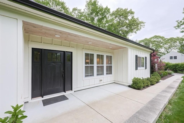 39 Chestnut St, Hopkinton, MA 01748 - entrance to property with board and batten siding and a patio area