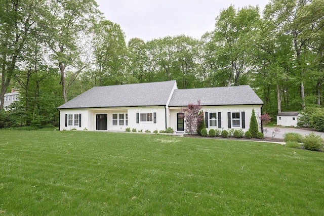 39 Chestnut St, Hopkinton, MA 01748 - view of front of property with a front lawn and view of wooded area