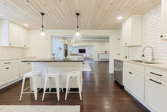 39 Chestnut St, Hopkinton, MA 01748 - kitchen with a sink, dishwasher, wooden ceiling, backsplash, and white cabinets