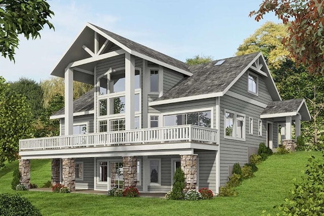 rear view of property with a balcony and a lawn