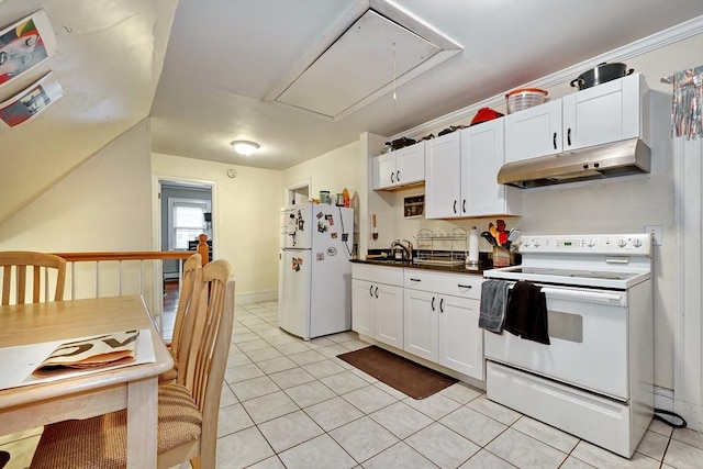 kitchen with light tile patterned floors, white cabinets, and white appliances