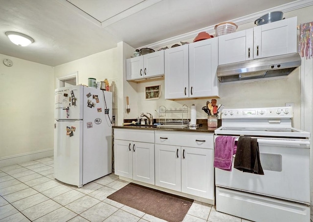 kitchen with white appliances, sink, light tile patterned floors, and white cabinets