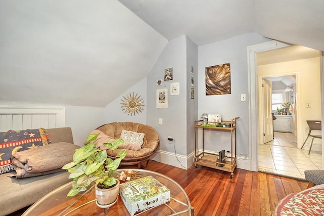 living room with lofted ceiling and hardwood / wood-style floors