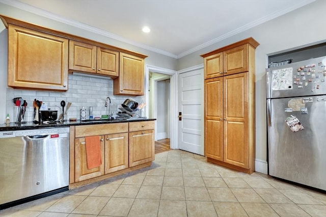 kitchen with light tile patterned flooring, appliances with stainless steel finishes, tasteful backsplash, sink, and ornamental molding