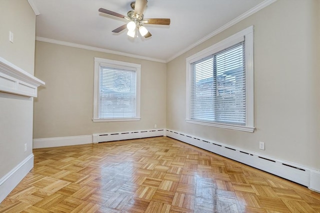 spare room featuring light parquet flooring, plenty of natural light, ornamental molding, and baseboard heating