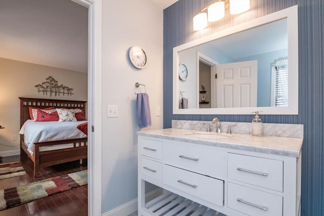 bathroom featuring hardwood / wood-style flooring and vanity