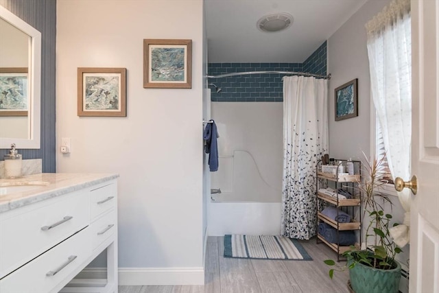 bathroom featuring shower / tub combo with curtain, vanity, and wood-type flooring