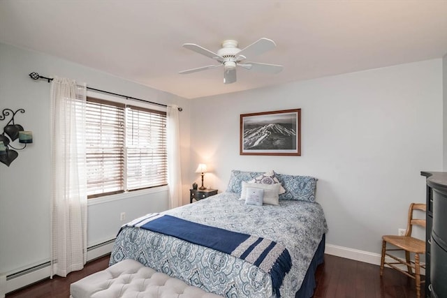 bedroom with baseboard heating, ceiling fan, and dark hardwood / wood-style floors