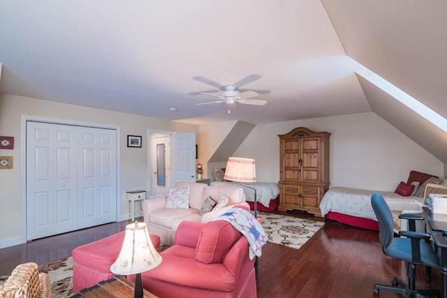 bedroom with dark wood-type flooring, a closet, ceiling fan, and vaulted ceiling