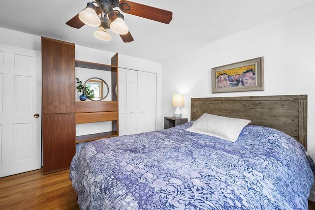 bedroom featuring a closet, ceiling fan, and wood finished floors