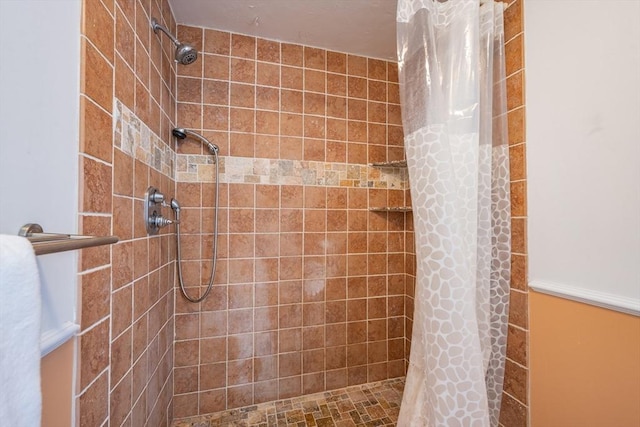 bathroom with a tile shower