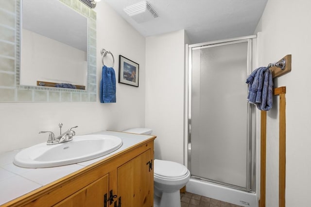 bathroom featuring visible vents, toilet, a stall shower, and vanity