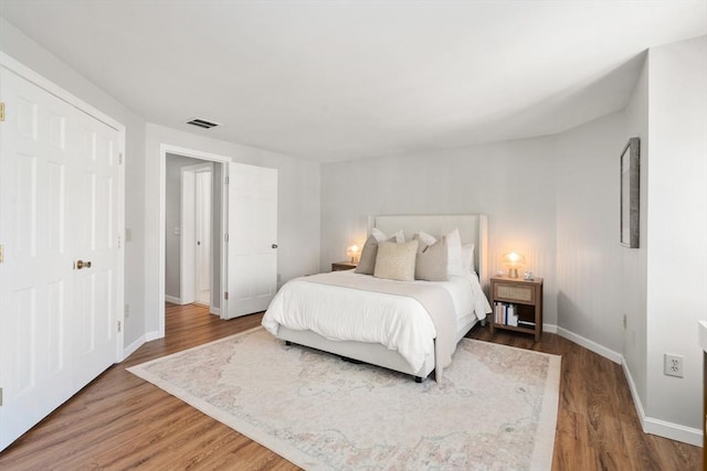 128 Parker St Unit 4C, Acton, MA 01720 - bedroom featuring baseboards and wood finished floors