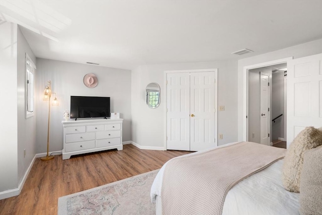 128 Parker St Unit 4C, Acton, MA 01720 - bedroom featuring wood finished floors, baseboards, and a closet