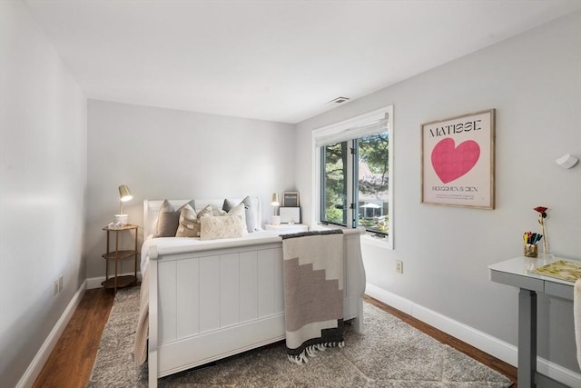 128 Parker St Unit 4C, Acton, MA 01720 - bedroom featuring dark wood-style flooring and baseboards