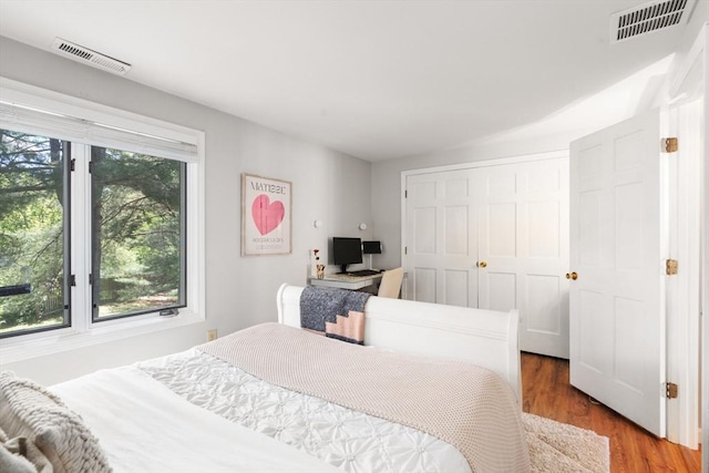 128 Parker St Unit 4C, Acton, MA 01720 - bedroom featuring wood finished floors and a closet