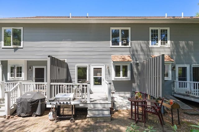 128 Parker St Unit 4C, Acton, MA 01720 - rear view of property with a wooden deck