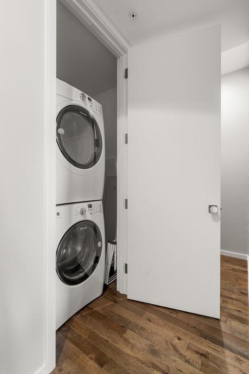 525 E 1st St Unit 5, Boston, MA 02127 - laundry area with stacked washer / dryer and wood finished floors