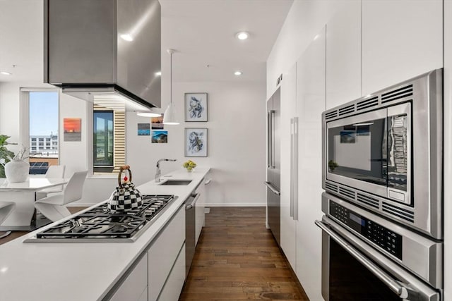 525 E 1st St Unit 5, Boston, MA 02127 - kitchen featuring appliances with stainless steel finishes, modern cabinets, a sink, white cabinetry, and recessed lighting